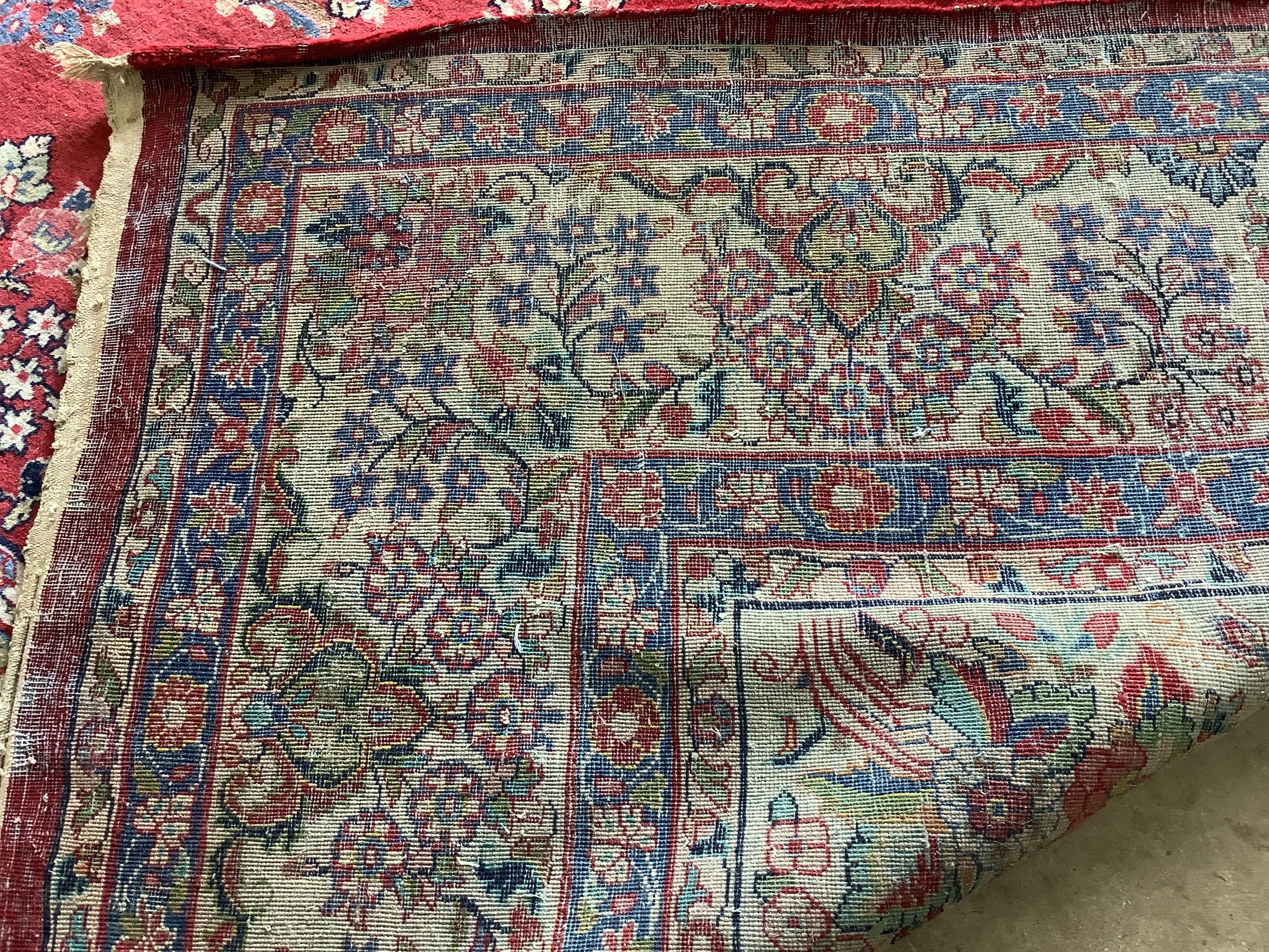 A North West Persian red ground carpet, 360 x 270cm
